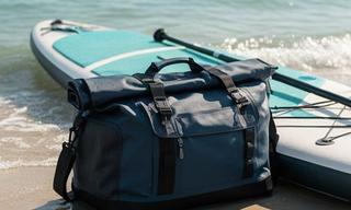 SaltGuard waterproof duffel bag beside a paddleboard at the Florida coast